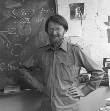 John Bell at a blackboard of equations at CERN