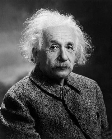 Albert Einstein in 1947, with white hair and a heavy jumper